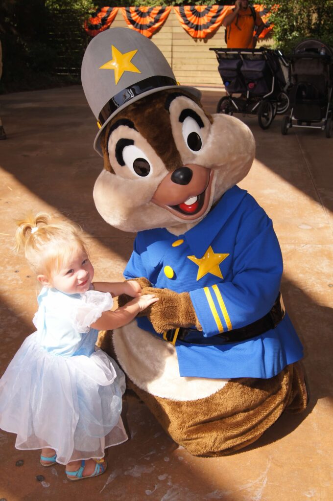 Chip dressed up in police officer costume with little girl dressed up like cincerella