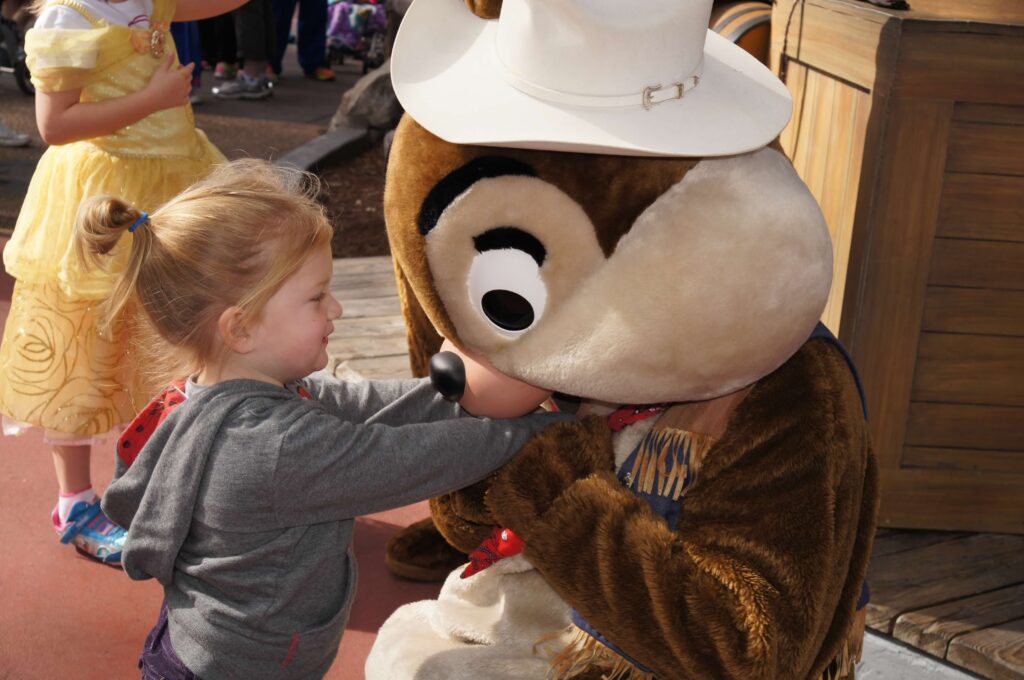 cowboy chip with little girl at disney world