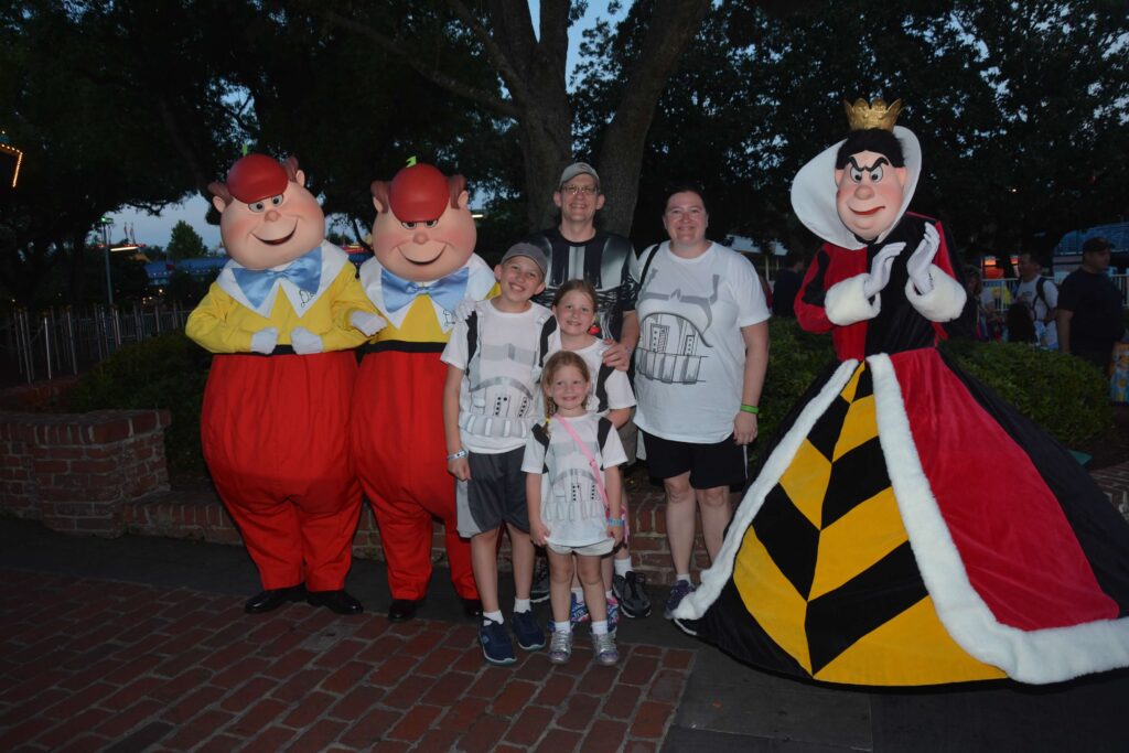 tweedle dee and tweedle dum with the queen of hearts and family meet and greet at disneyworld