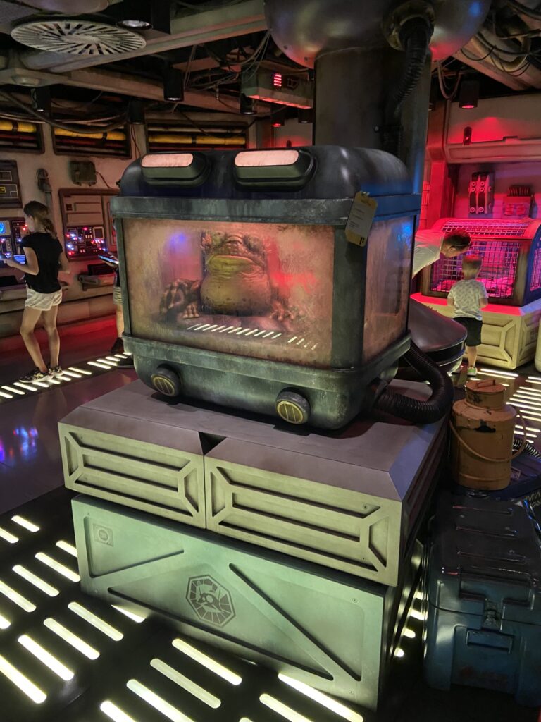 the disney wish kids club has a star wars area filled with immersive play including lots of buttons to push and a cargo hold full of unusual creatures that move and interact