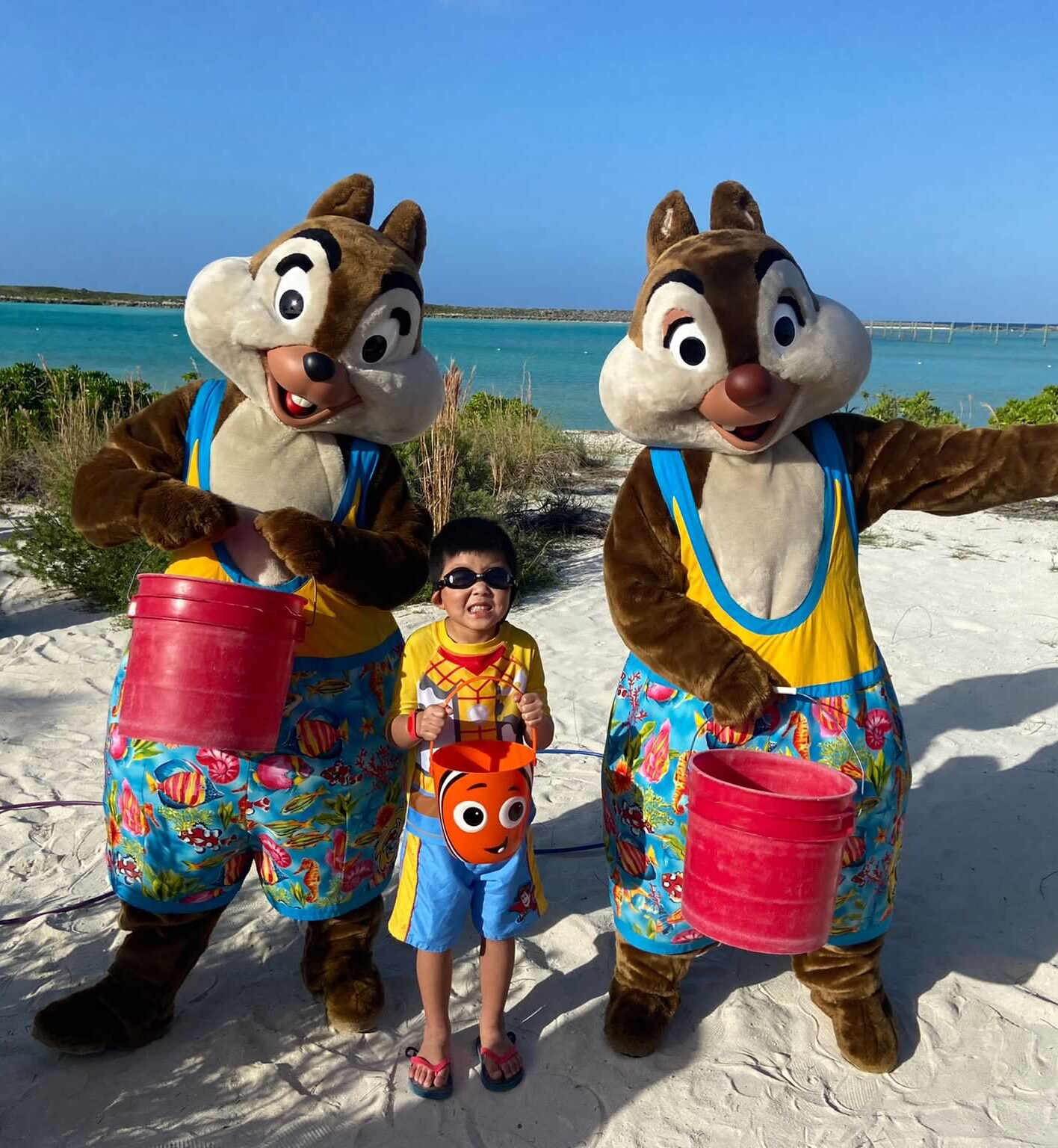 Disney Cruise line private island Castaway cay private beach characters engaging wth little boy