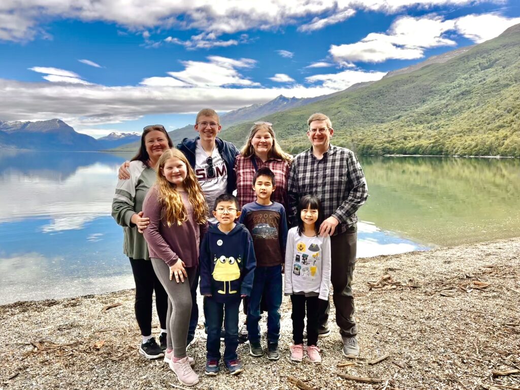 Tierra de fuego national park in Ushuaia, Argentina family with lake and mountain background