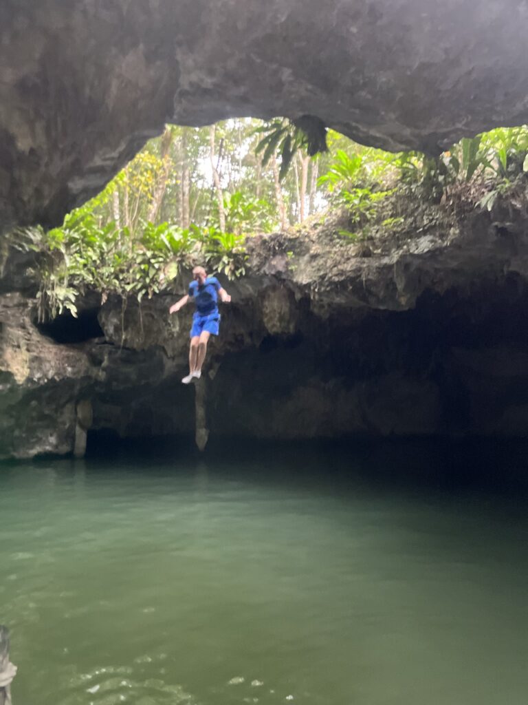 Jumping into a cenote in the jade cavern in Mexico