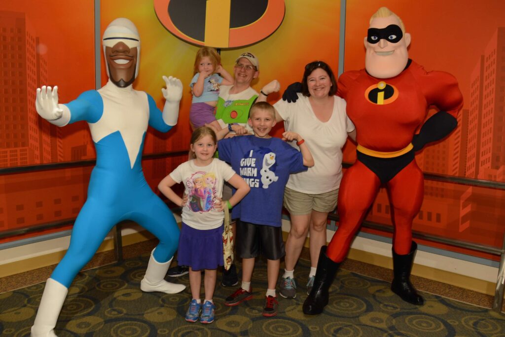 family with frozone and mr incredible for character meet and greet at hollywood studios disney world florida