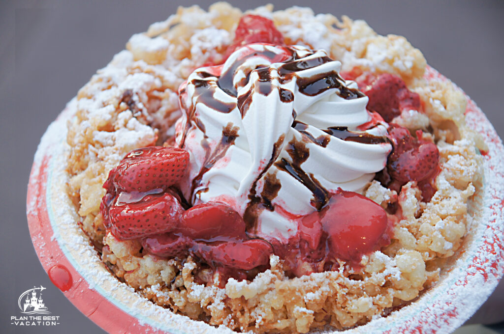 funnel cake loaded with strawberries and cream at hollywood studios disney world florida
