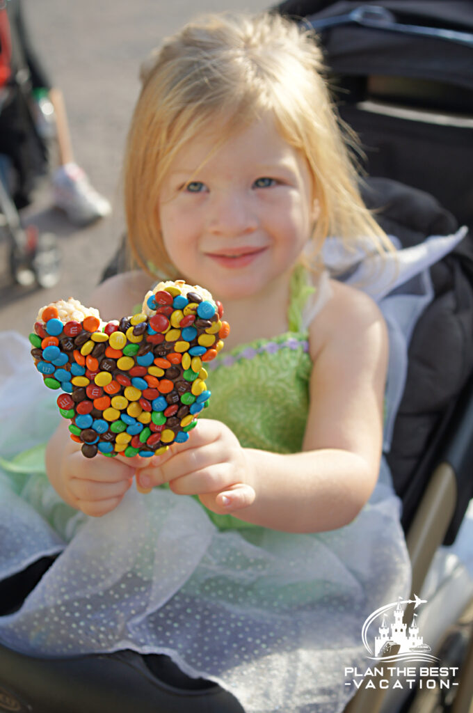 mm coated mickey rice krispie treat on a stick is a fun disney dining plan snack for kids