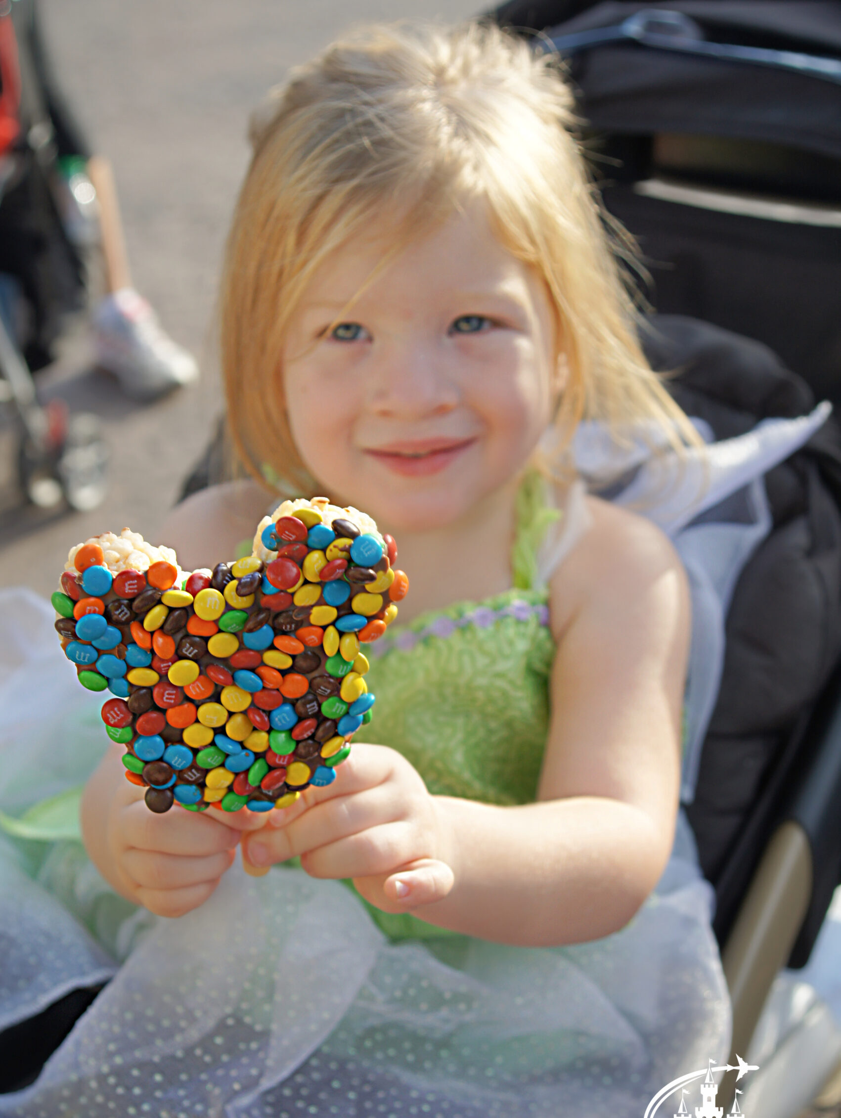 mm coated mickey rice krispie treat on a stick is a fun disney dining plan snack for kids