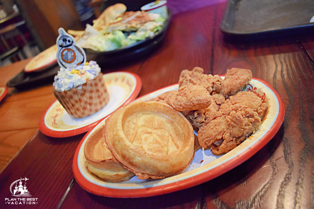 quick service meal of chicken and waffles with bb8 cupcake at backlot express in hollywood studios disney world florida