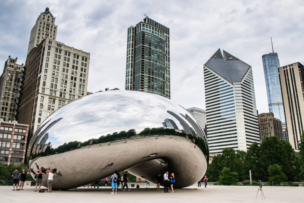 skyline of chicago through the famous monument Cloud Gatealso known as the bean in the Millennium Park chicago illinois