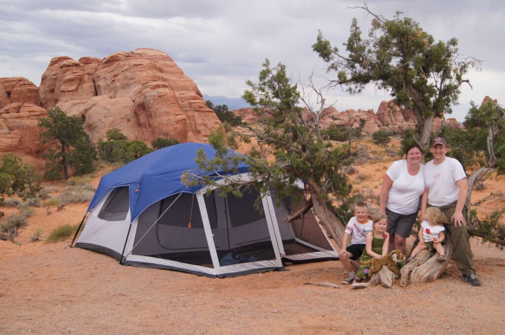 Family Camping at arches state park in utah in tent Image copyright protected all rights reserved
