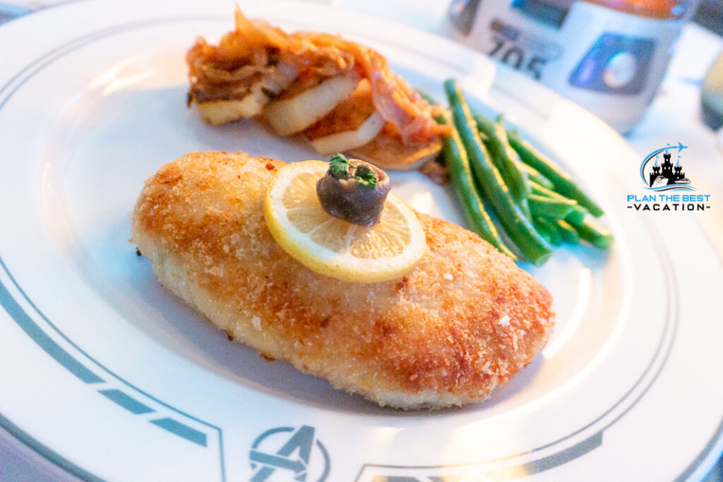 Chicken Schnitzel (panko-crusted chicken breast, sauted potatoes, carmelized onions, long green beans, lemon, anchovy, capers)