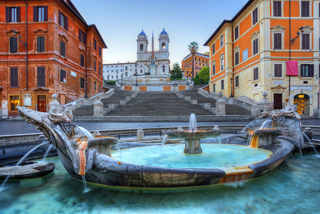 Fontana della Barcaccia on Piazza di Spagna with spanish steps behind