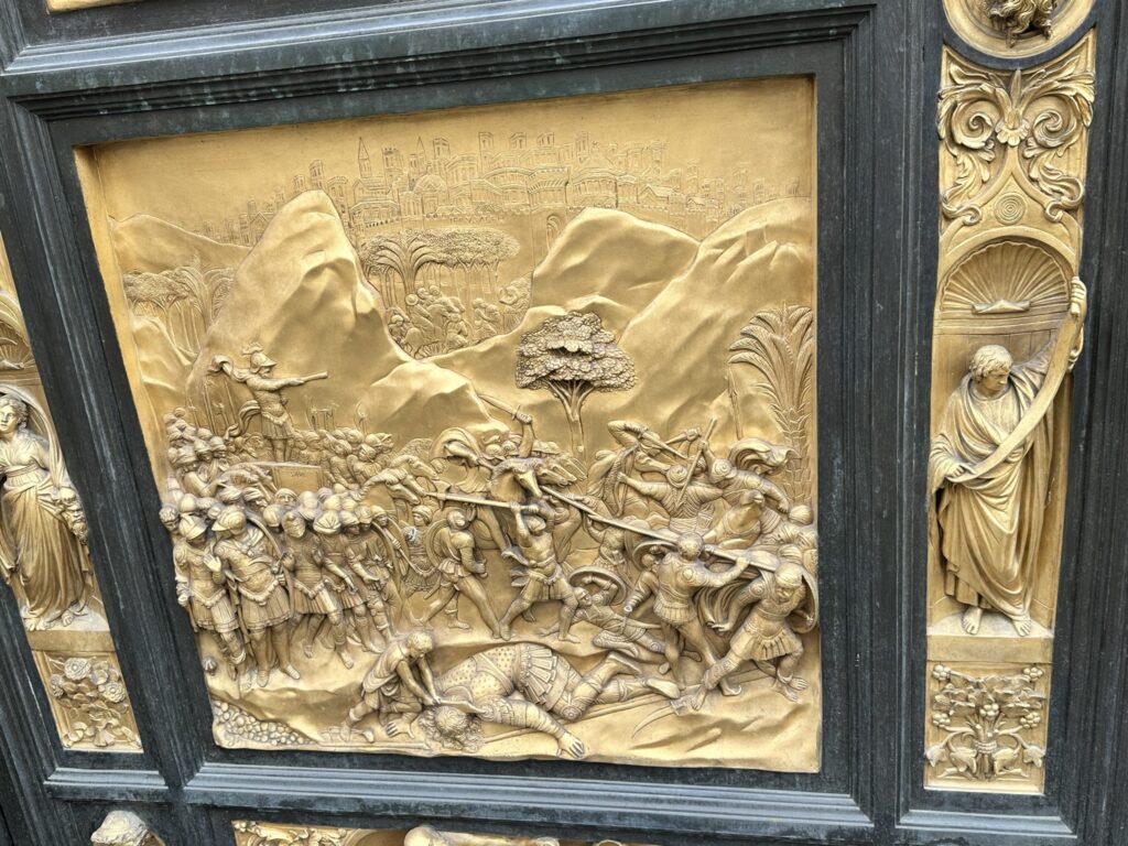 Story of David and Goliath on bronze doors on duomo baptistry doors florence italy