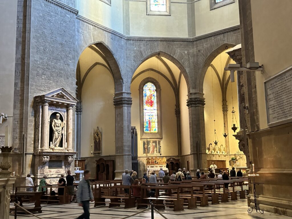 Inside, the naves are set out by the immense pillars and ample gothic arches of Talenti, while the floor decorations in inlaid marble mosaic are by the grand ducal workshops of the 16th-17th centuries