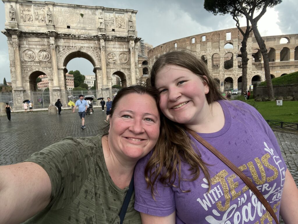 Having fun seeing the colosseum and titus arch despite rain