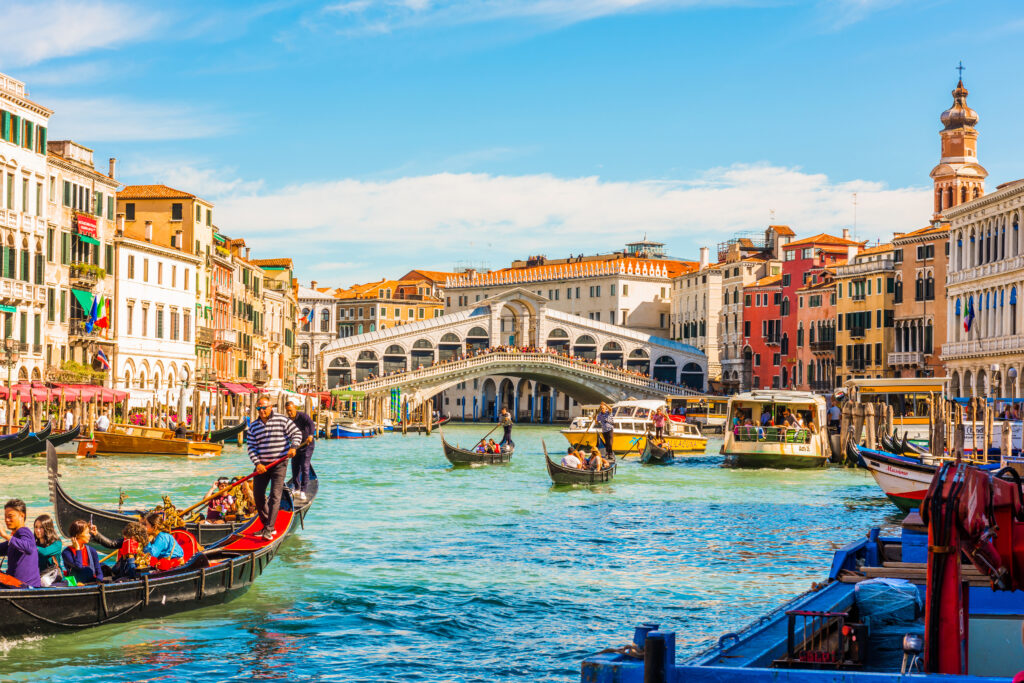 Panoramic view of the Grand Canal with gondolas and the Rialto Bridge Venice Italy