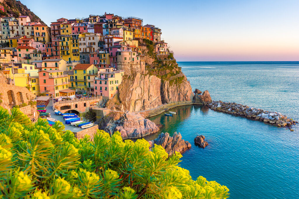 Sunset in Manarola, Cinque Terre, Italy. Amazing town in the italian mediterranean sea coast.

