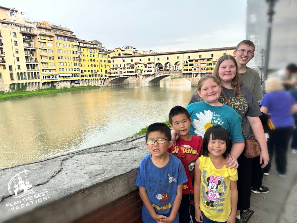 family picture of kids in front of The Ponte Vecchio