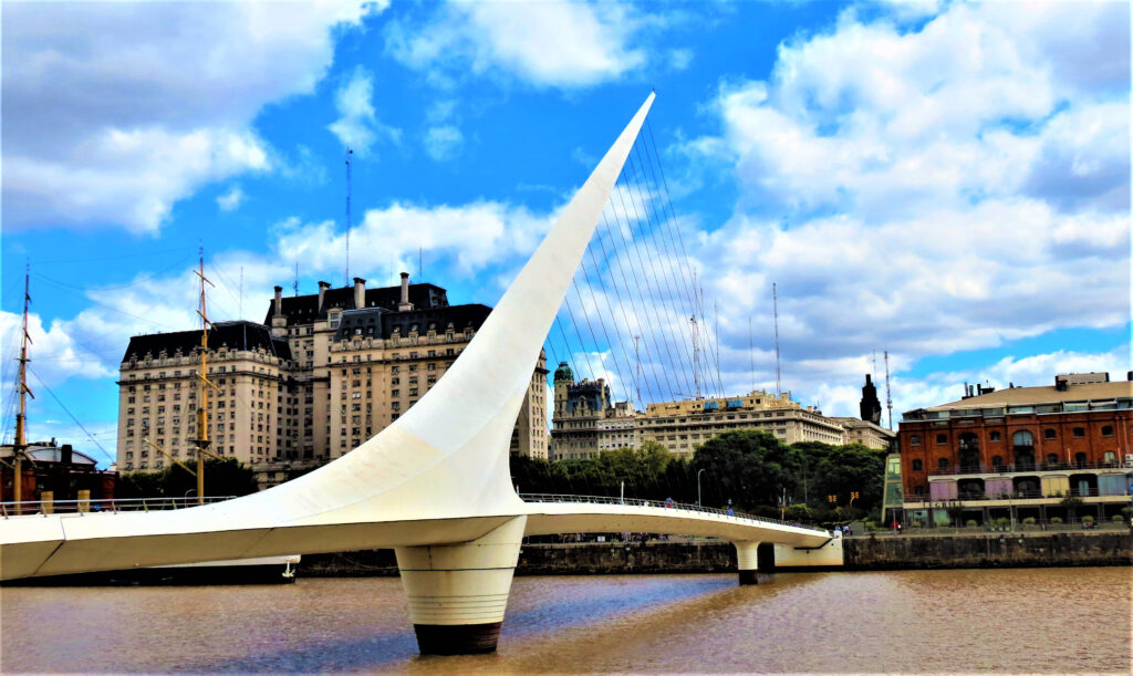 The Woman´s Bridge ( Puente de la Mujer ) designed by the Spanish architect Santiago Calatrava. The Frigate Presidente Sarmiento at the Puerto Madero waterfront.