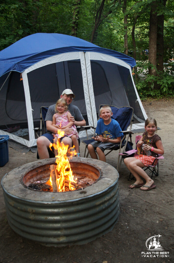 camping campfire with family and tent