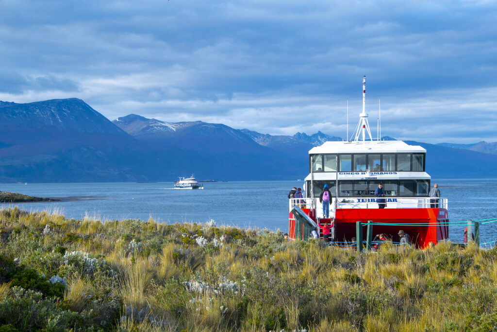 catamaran arrving to one of the islands at beagle channel, ushuaia, argentina tierra del fuego, argentina