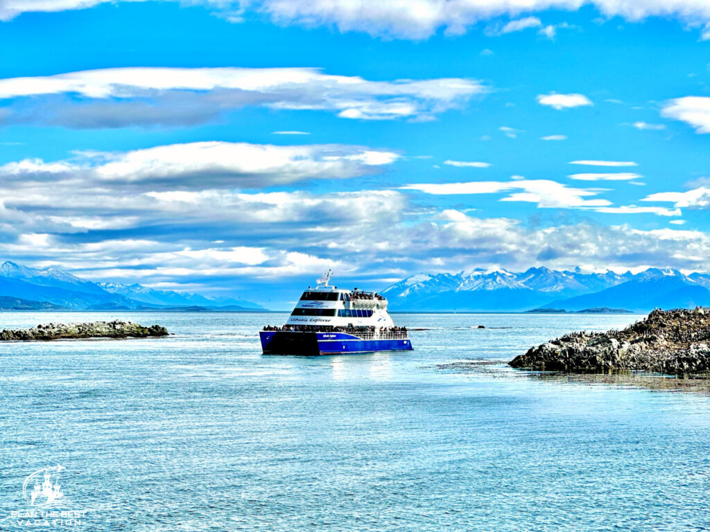 catamaran tour of beagle channel with beautiful snow capped mountains behind