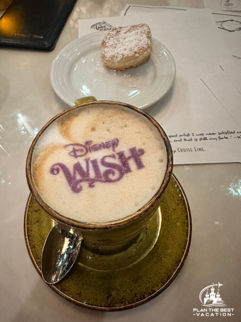 disney cruise coffee with wish name on top with beignet in back
