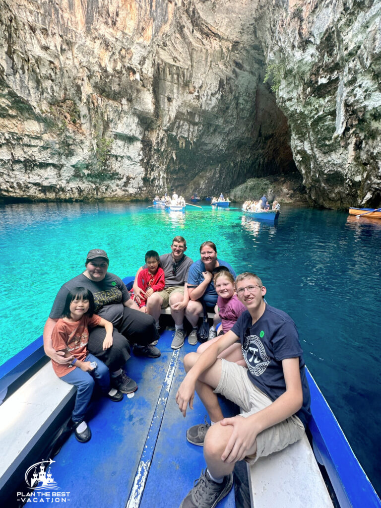 family picutre in argostoli greece on boat in Melissani Lake a pretty cavern