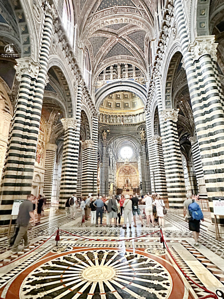 inside of siena cathedral with striped marble