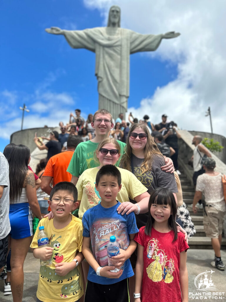 kids in front of Christ the Redeemer Momument in Rio de Janeiro Brazil