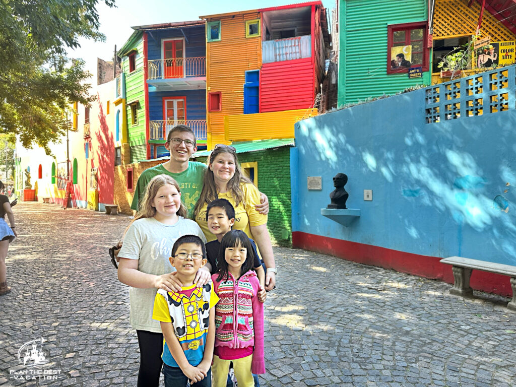 kids in front of colorful fascades in la boca neighborhood buenos aires