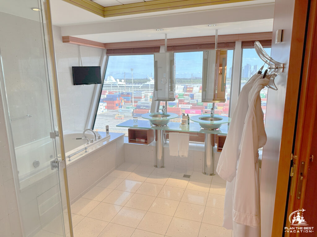 norweigan star 3 bedroom garden villa suite 3rd bedroom bathroom with jetted tub, walk in shower with jets, double vanity, storage, and seperate toilet and lots of huge picture windows