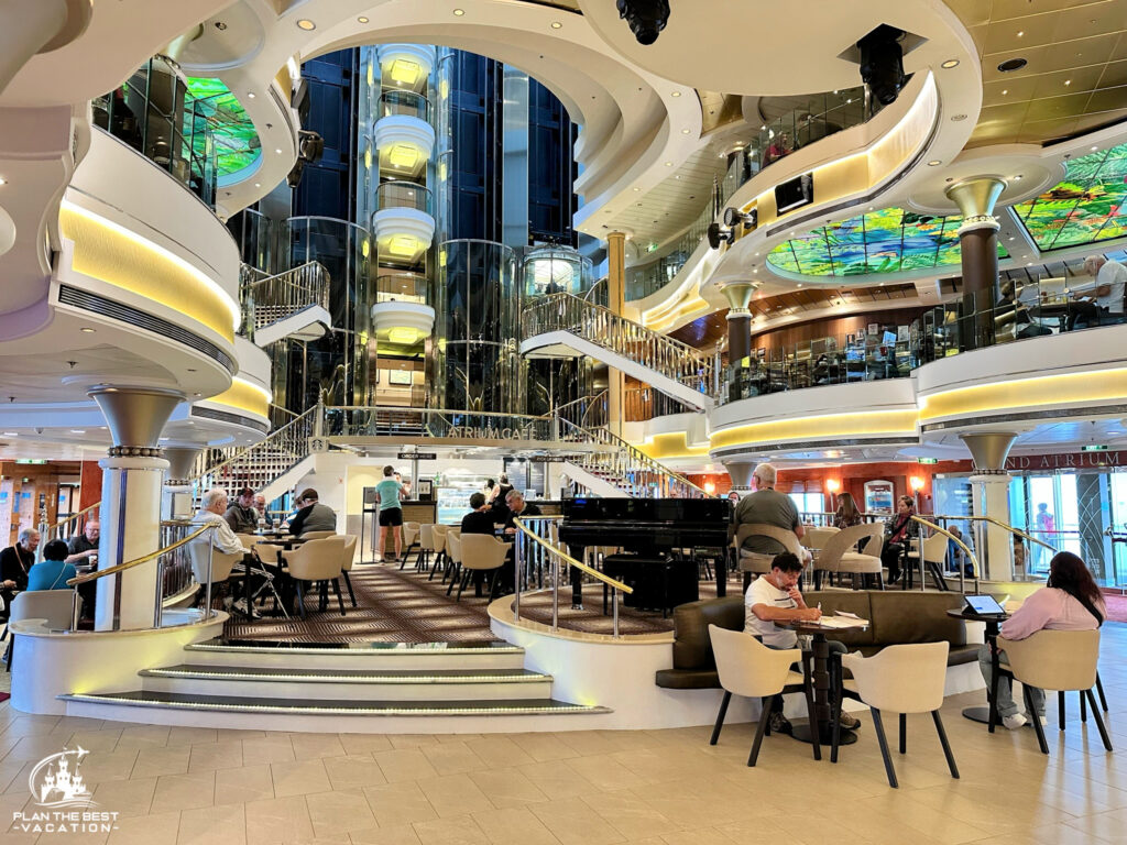 norweigan star 3-story atrium on deck 7, 8, 9 with starbucks live music, seating, o sheenans