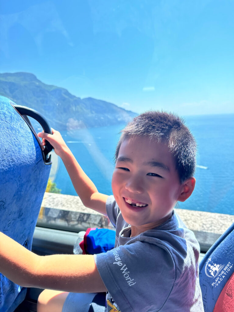 view on the drive from amalfi coast with cute boy in front