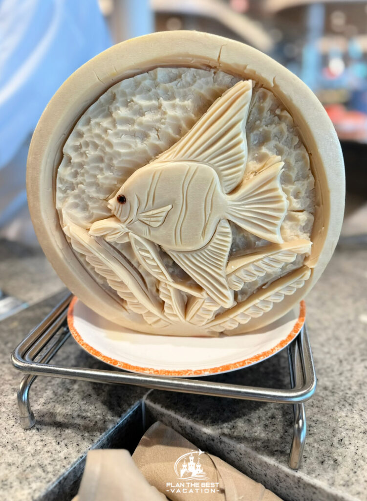 icon of the seas food - fish bowl carved out of cheese wheel