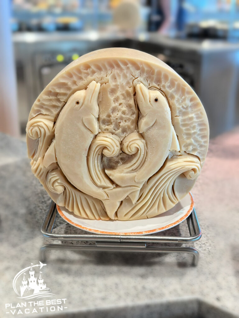 royal caribbean food carving dolphins in cheese wheel