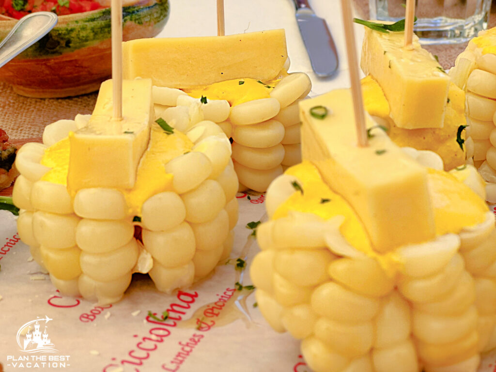 CiccioLina catered lunch in cusco peru with giant corn with cheese on top