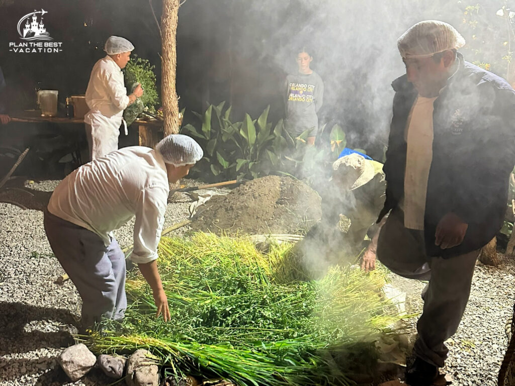 adding grasses and herbs for flavoring the Pachamanca