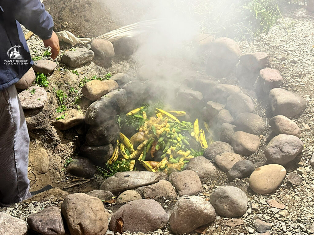 adding the veggetables to the Pachamanca