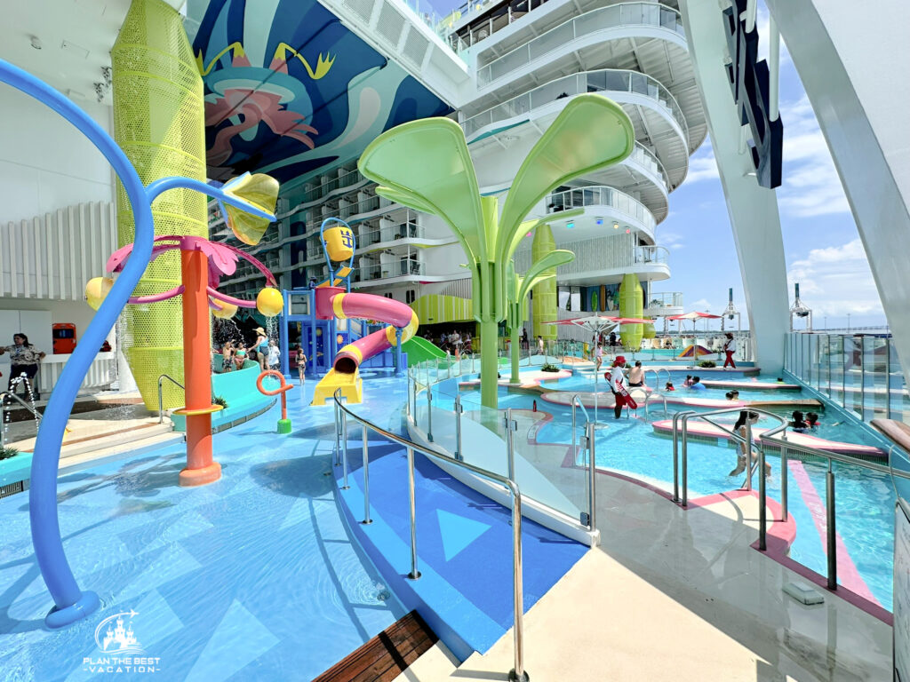 If you have younger kids, you will want to head to Deck 7 and the Sufrside neighborhood. You'll know you are there because you will be at the back of the boat with a beautiful view, large whimsical flaingo, and lots of happy kids playing! The kids waterpark on the Icon of the Seas has lots of colorful waterslides, water cannons, fountains, pools, tipping water buckets, and whirlpools for tots to tweens (and their parents). There is also a pool adjacent for both kid fun and water views. This area is for potty trained children only; they can not be wearing a diaper. jFor the slide there is a minimum height of 42" and maximum weight of 300 pounds.