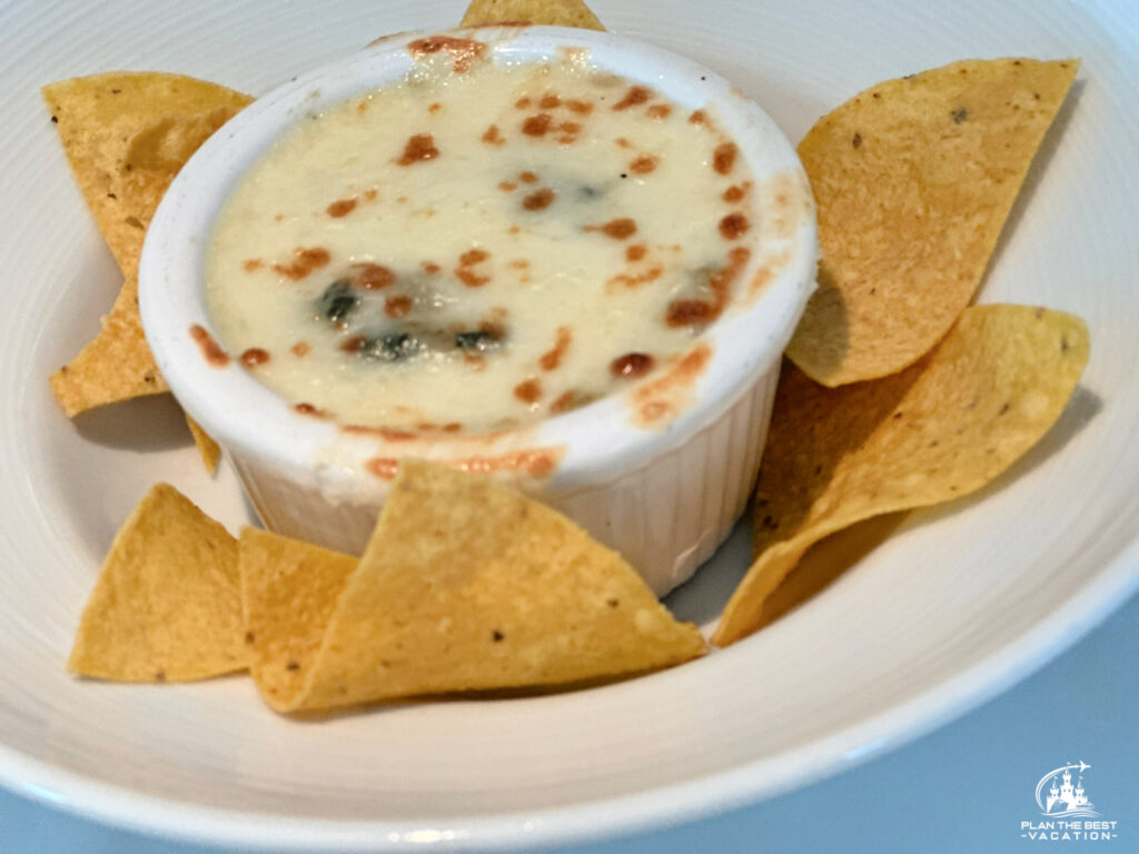 icon of the seas main dining room appetizer spinach and artichoke dip with tortilla chips