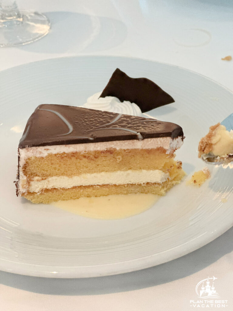 icon of the seas main dining room food desset boston cream pie