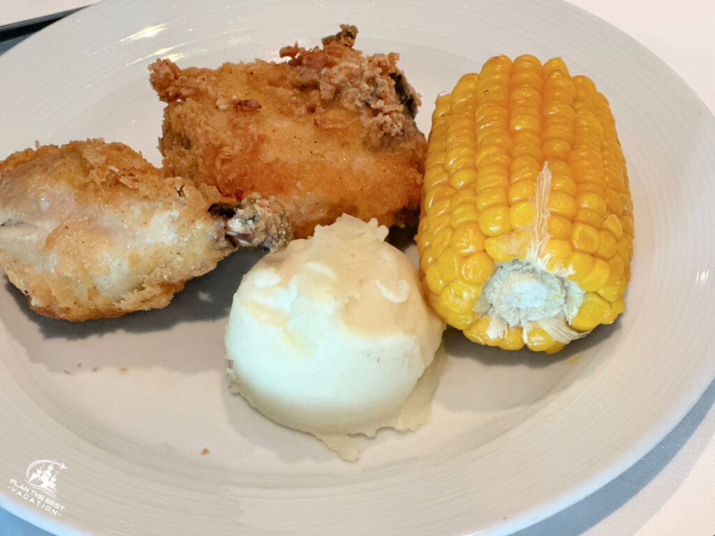 icon of the seas main dining room food main dish southern fried chicken mashed potatoes and corn on the cob