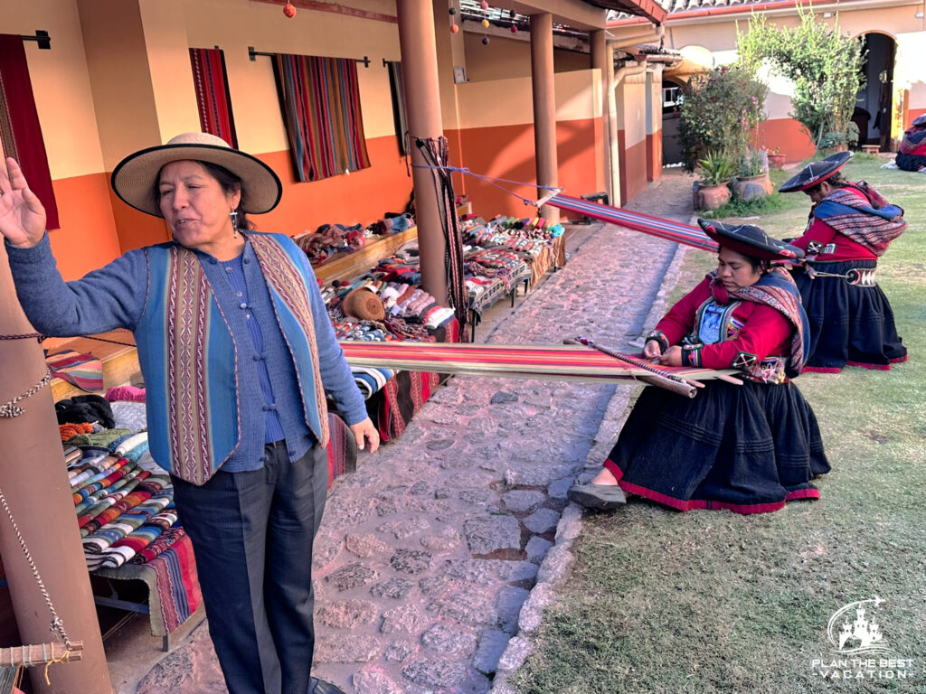 making textiles by hand with a loom in peru wearing traditional clothes