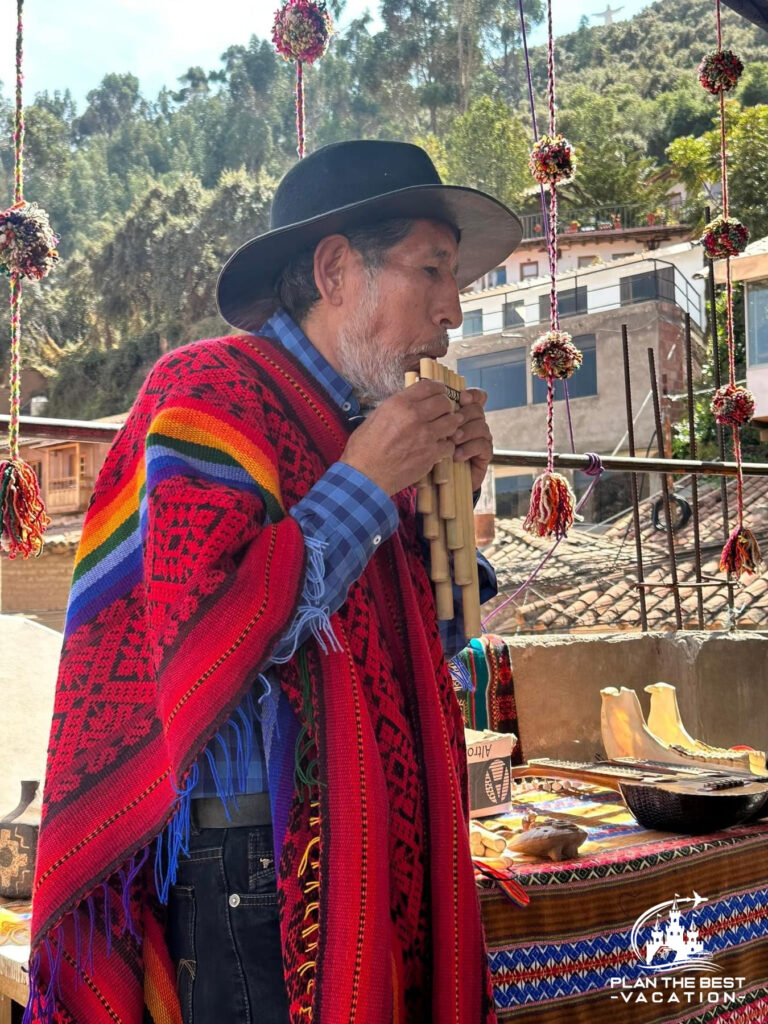 peruvian man playing panflute