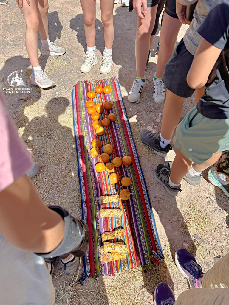 snack during hot dusty hike around rim of Salinas de Maras with Adventures by Disney Peru