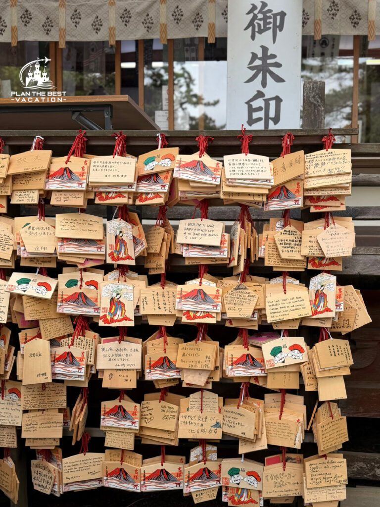 prayers written on woodwith red ribbon hanger Hakone Shrine
