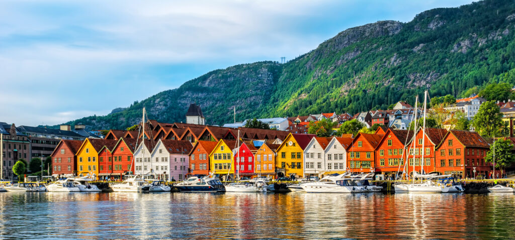 Explore the city of Bergen on your visit. One of the highlights of any visit to Bergen is the iconic Bryggen Wharf, a UNESCO World Heritage site. This historic area is lined with colorful wooden buildings that date back to the Hanseatic League, showcasing the city's importance as a trading hub in the past. Strolling along the narrow alleyways, visitors can explore unique shops, art galleries, and cozy cafes that invite you to indulge in local delicacies. Don't miss the chance to try fresh seafood, including the famous Norwegian salmon and traditional dishes like fish soup and stockfish.

For those looking to soak in some culture, Bergen offers a range of museums, including the Edvard Grieg Museum, dedicated to the famous composer who lived in the area, and the KODE Art Museum, which houses an extensive collection of art spanning various eras.

For those on cruise port excursions you can find many bus tours, segway tours, bike tours, tour bergen on foot, and more!