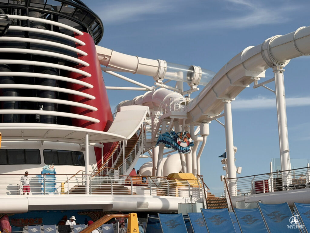 The AquaDuck on the Disney Dream is a 765-foot-long water coaster. It features a four-deck drop, transparent acrylic tubes that extend over the side of the ship, and water jets that push riders uphill at 20 feet per second