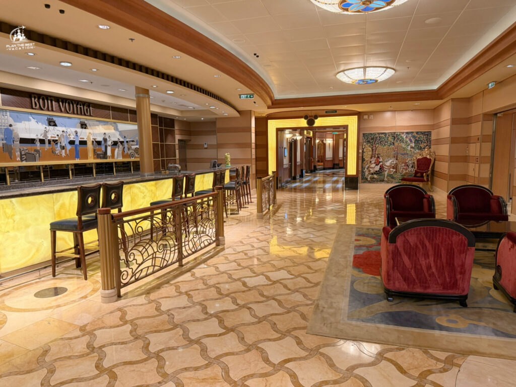 The Bon Voyage Bar is a sophisticated, Art Deco-inspired lounge located on Deck 3, Midship in the grand atrium of the Disney Dream.